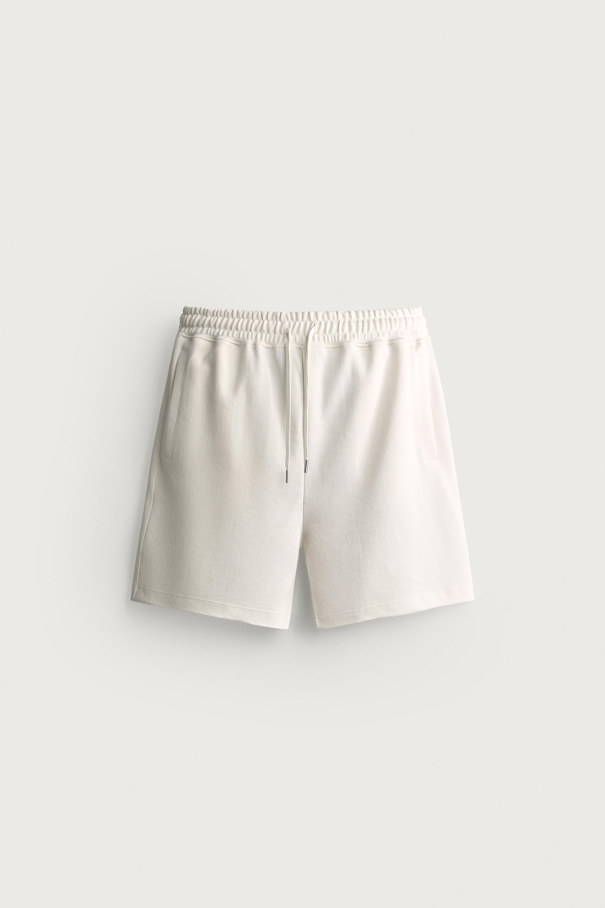 RELAXED FIT INTERLOCK TRACK SHORTS — Oyster-white