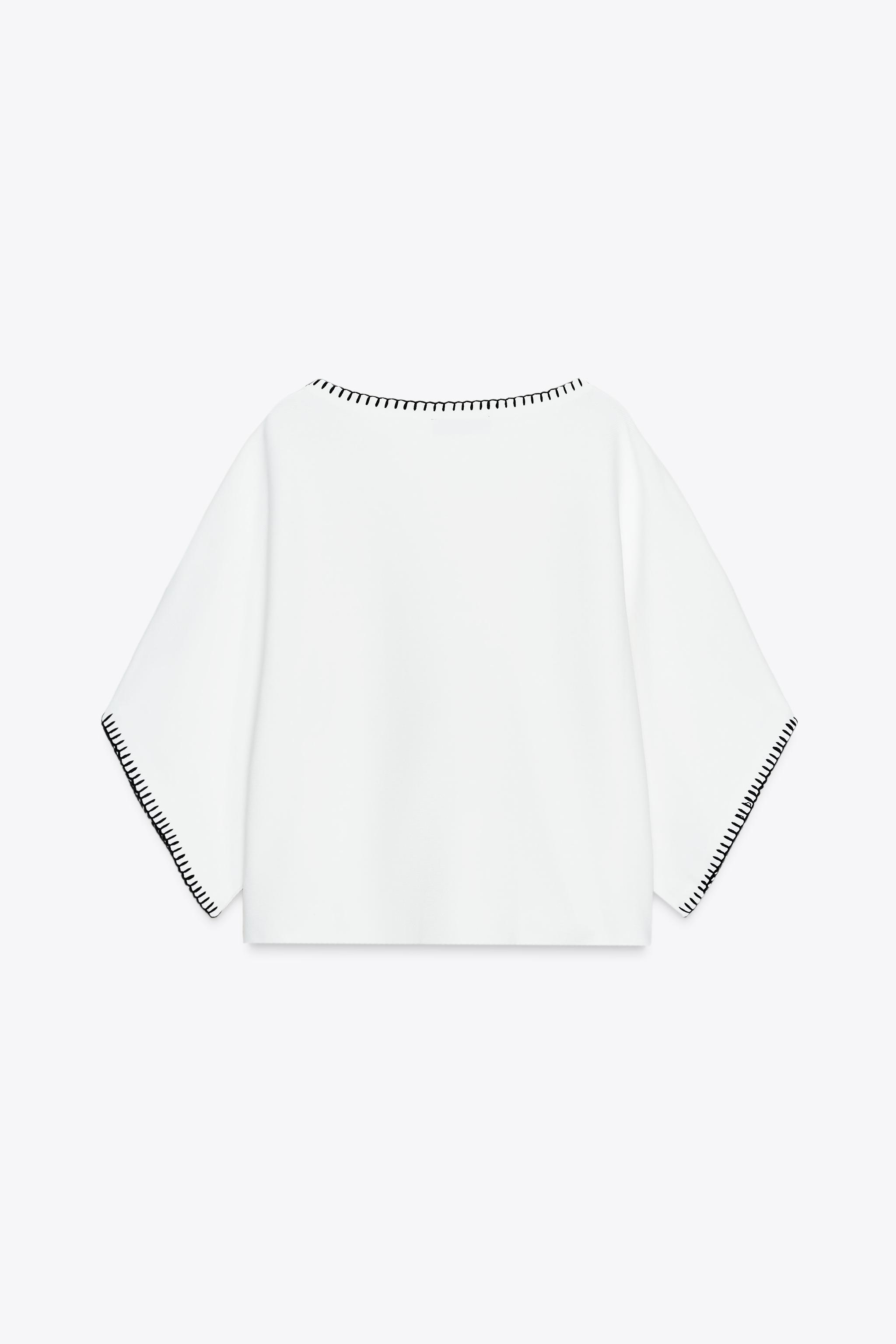 CONTRASTING EMBROIDERED KNIT TOP