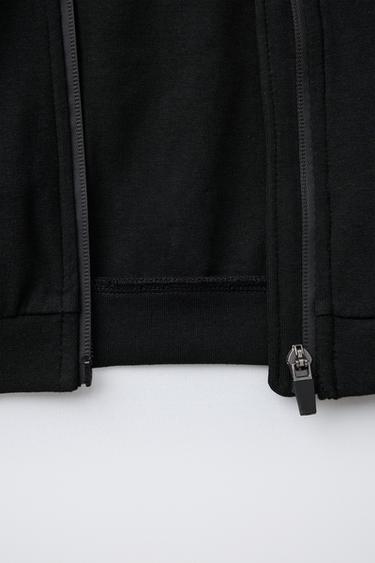 SUDADERA INTERLOCK CREMALLERA CAPUCHA LOGO - Negro de Zara
