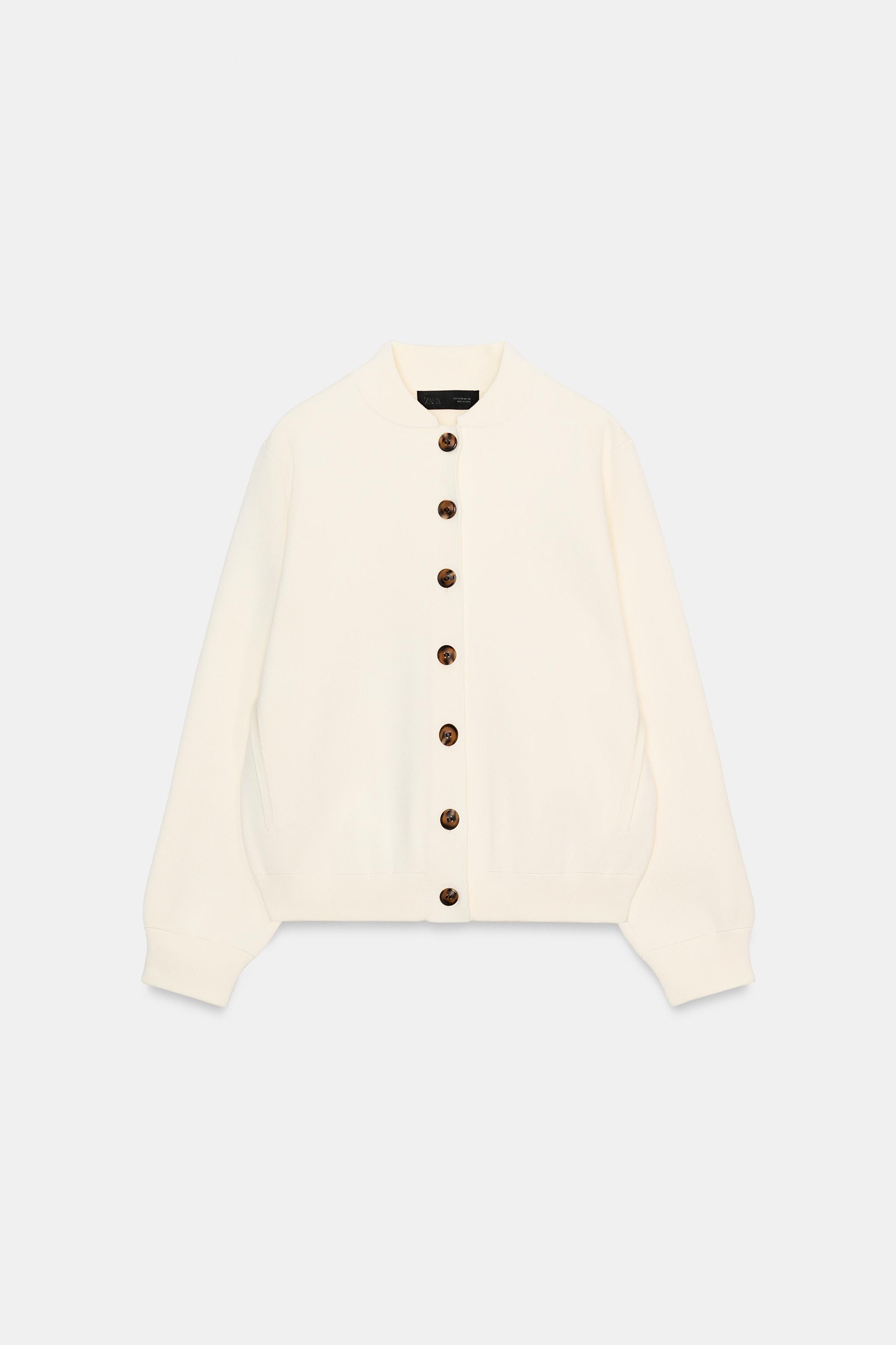 GILET EN MAILLE À BOUTON CONTRASTE