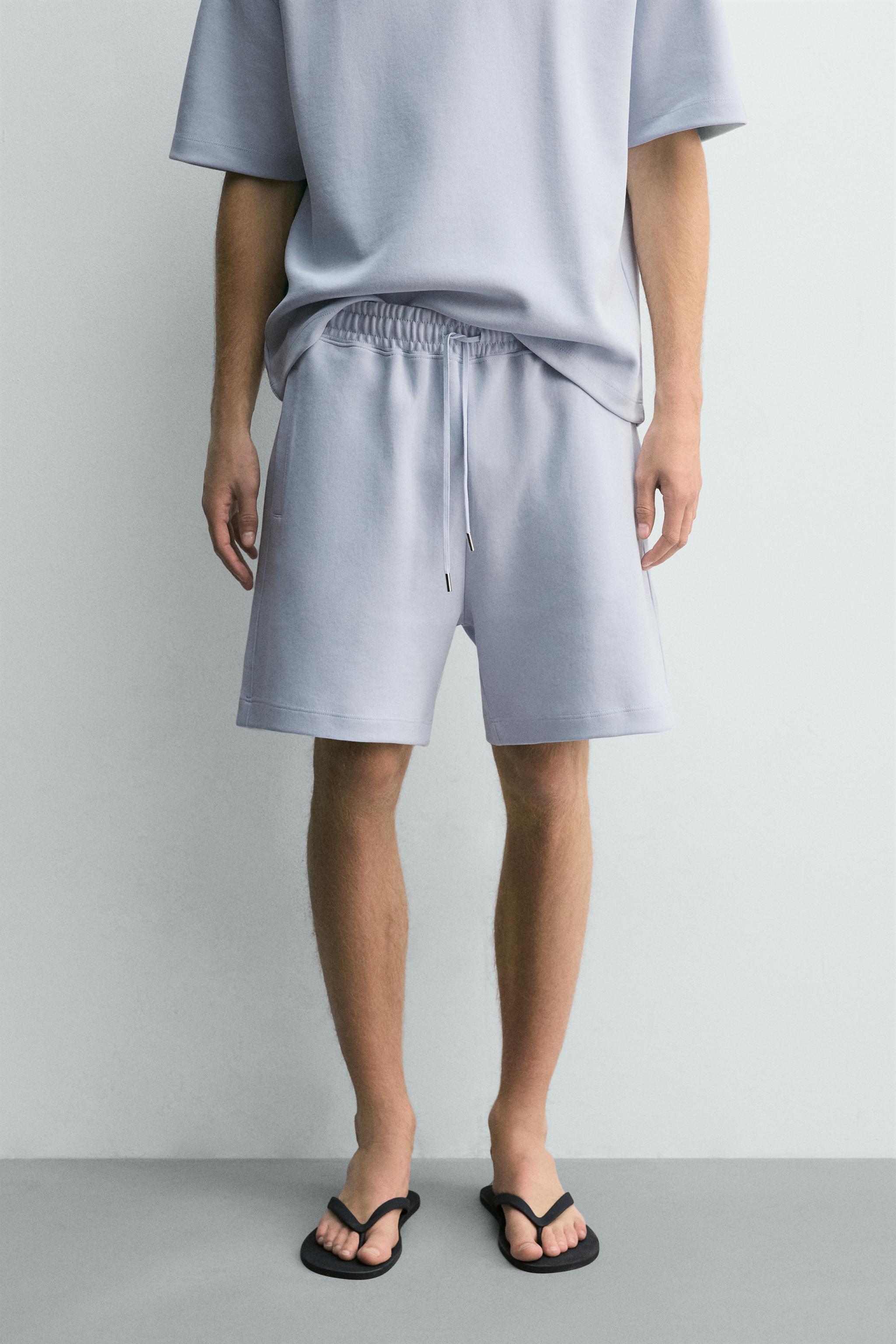 RELAXED FIT INTERLOCK TRACK SHORTS — Sky blue