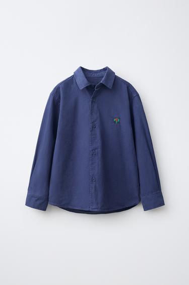CAMISA CON DETALLE BORDADO