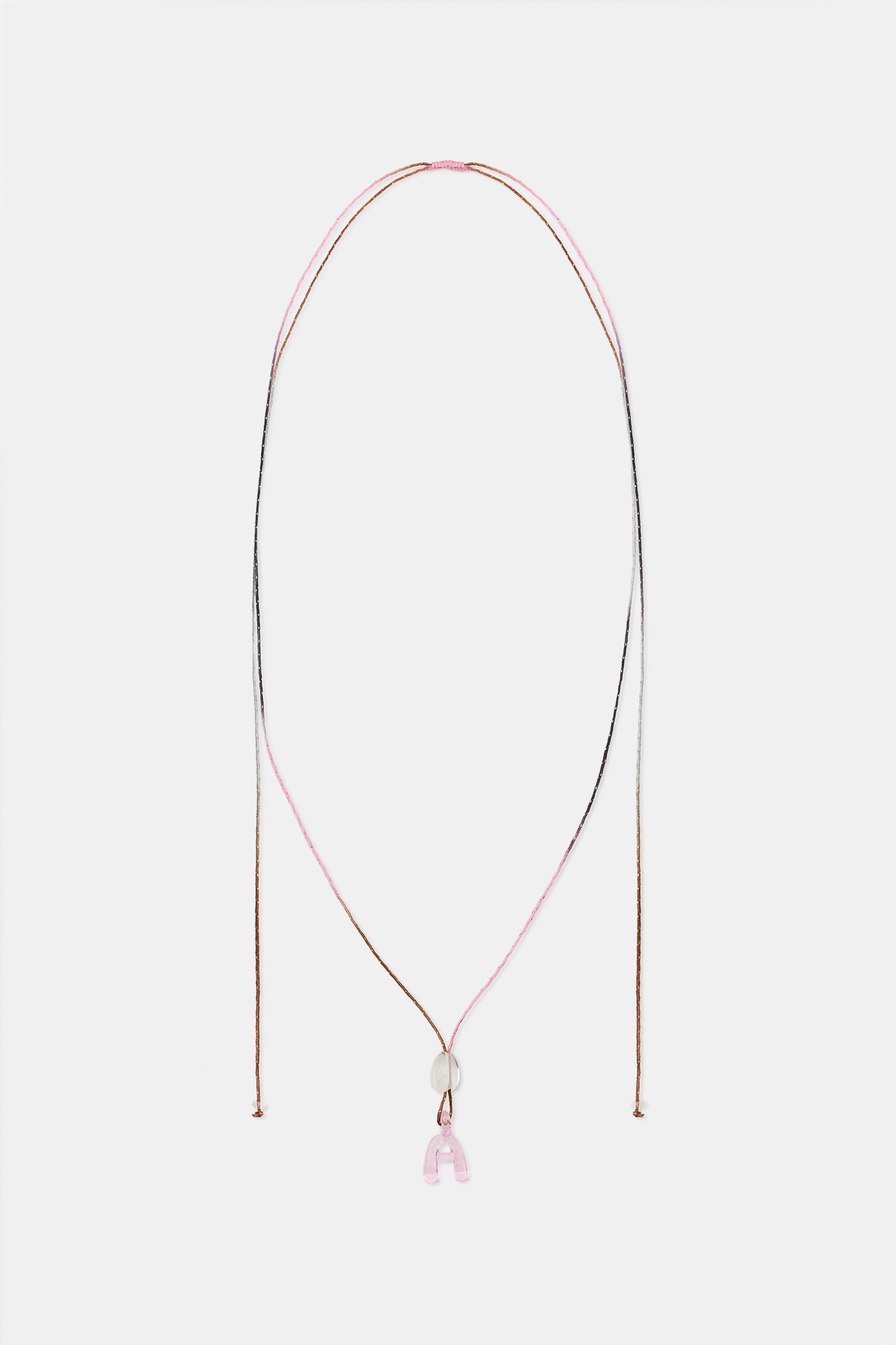 ALPHABET LETTER CORD NECKLACE — Pink