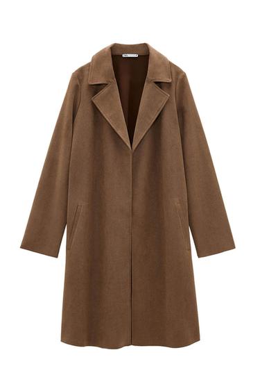 Straight-cut brown coat with wide lapels and side pockets. Visible label on the neck with the text "ZARA".