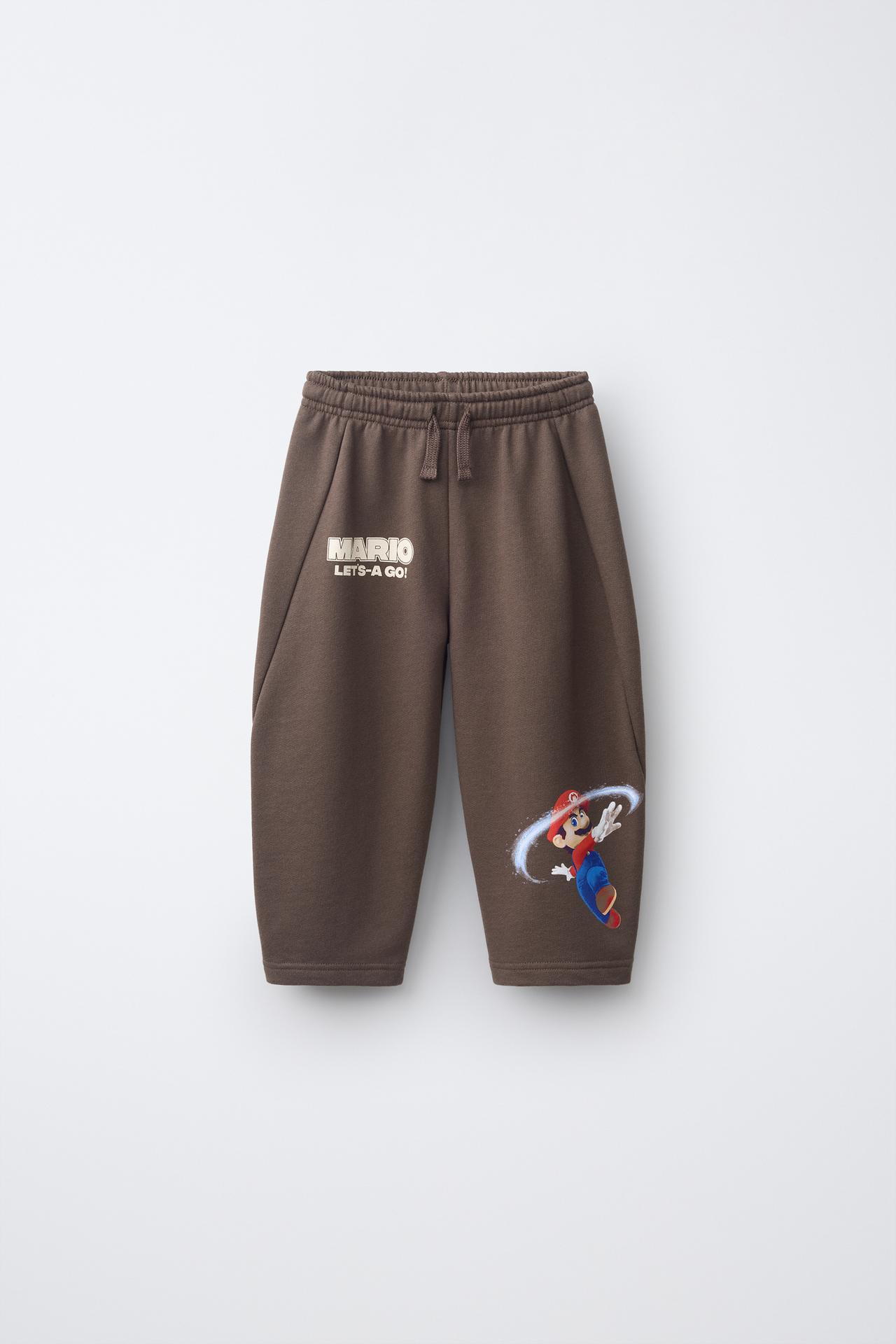 MARIO BROS. ™ © NINTENDO PRINT BARREL-LEG PANTS — Brown