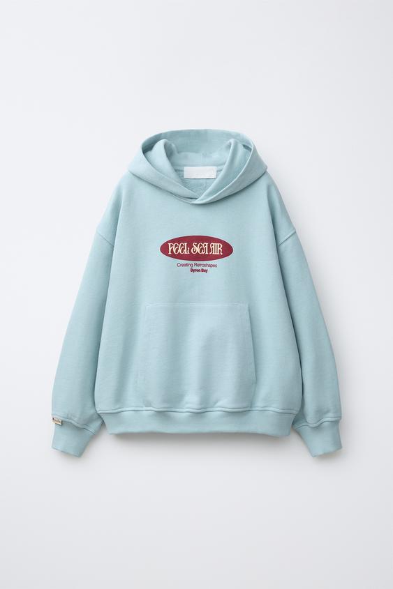SUDADERA CAPUCHA ESTAMPADO SURF - Azul cielo de Zara - Imagen 0