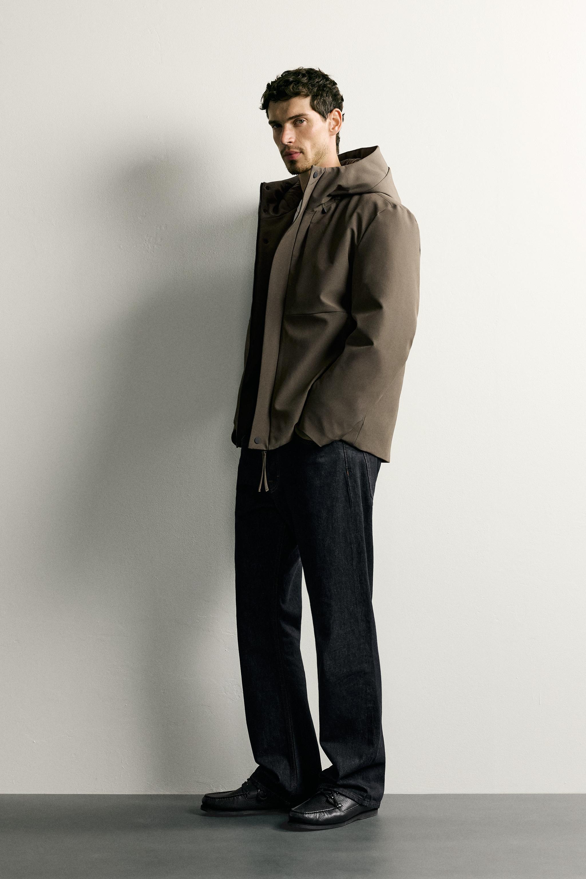 BLOUSON TECHNIQUE À CAPUCHE DÉPERLANT