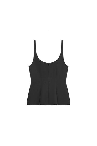 Front view of a black top with thin straps and a round neckline. Fitted design with vertical seams and a back fastening.