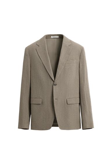 Brown Americana jacket with plaid pattern, notched lapels, single-button closure, and flap pockets on a white background.
