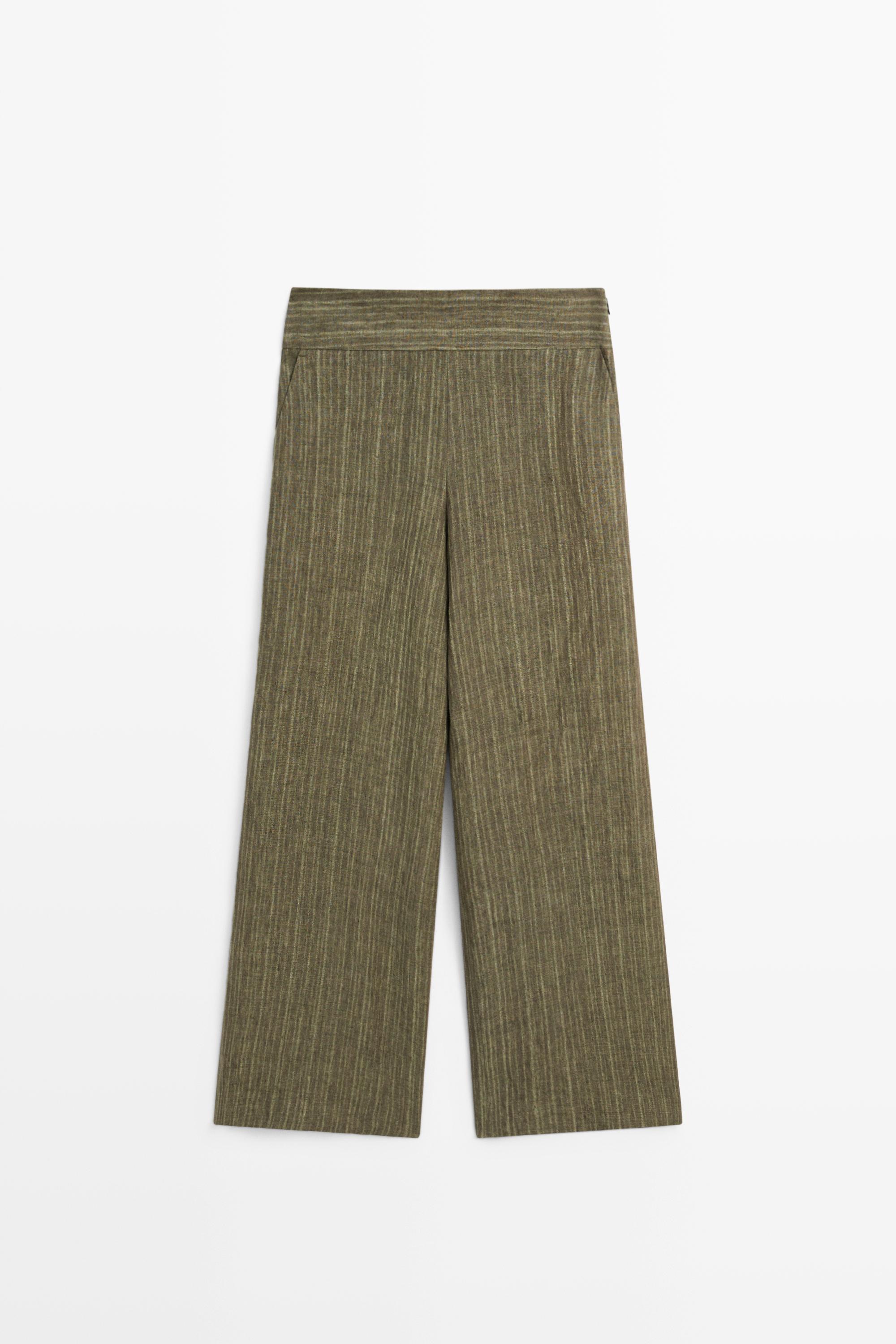 Total look linen trousers with corset belt detail