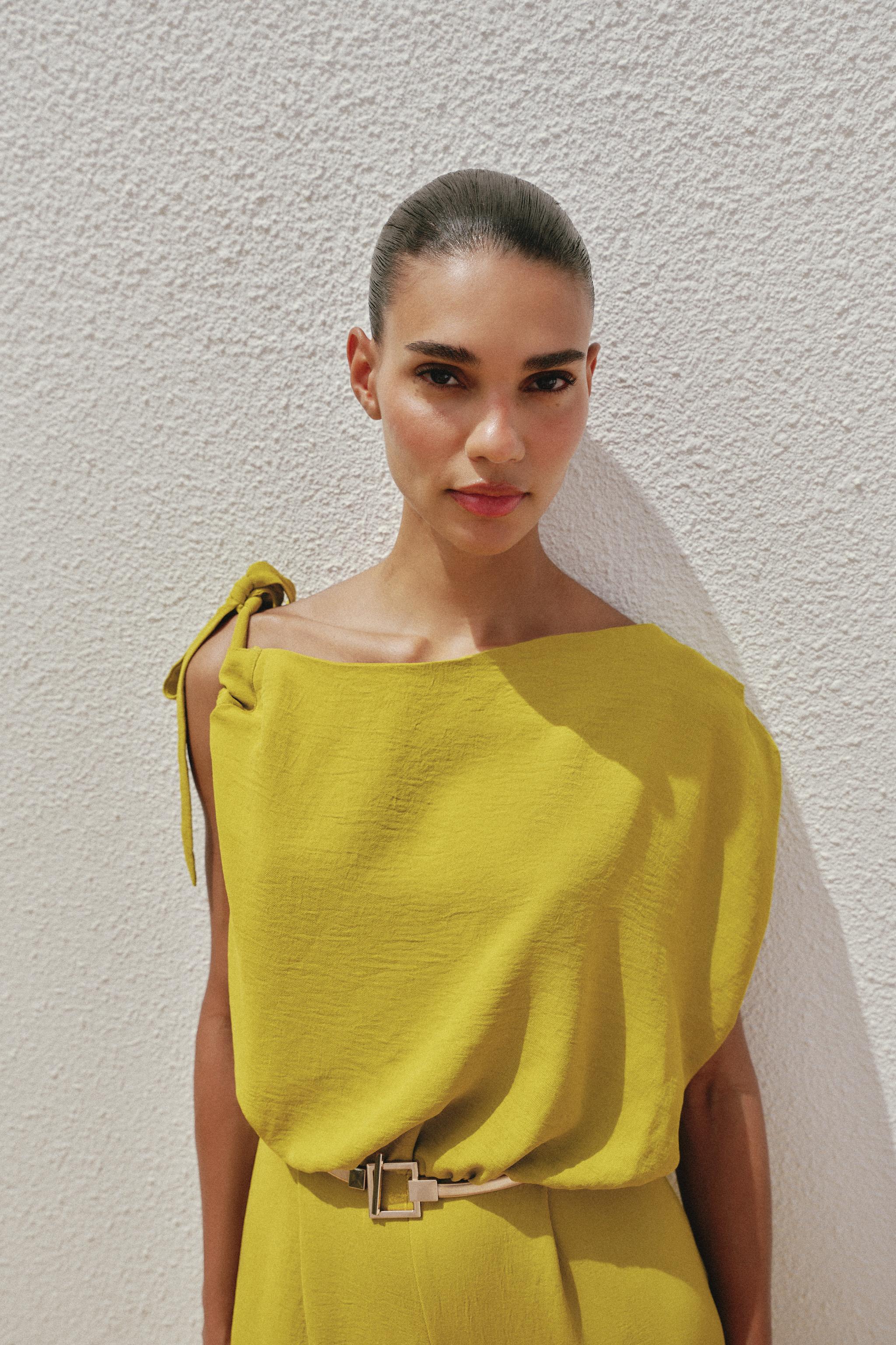 ASYMMETRIC SLEEVE BELTED JUMPSUIT