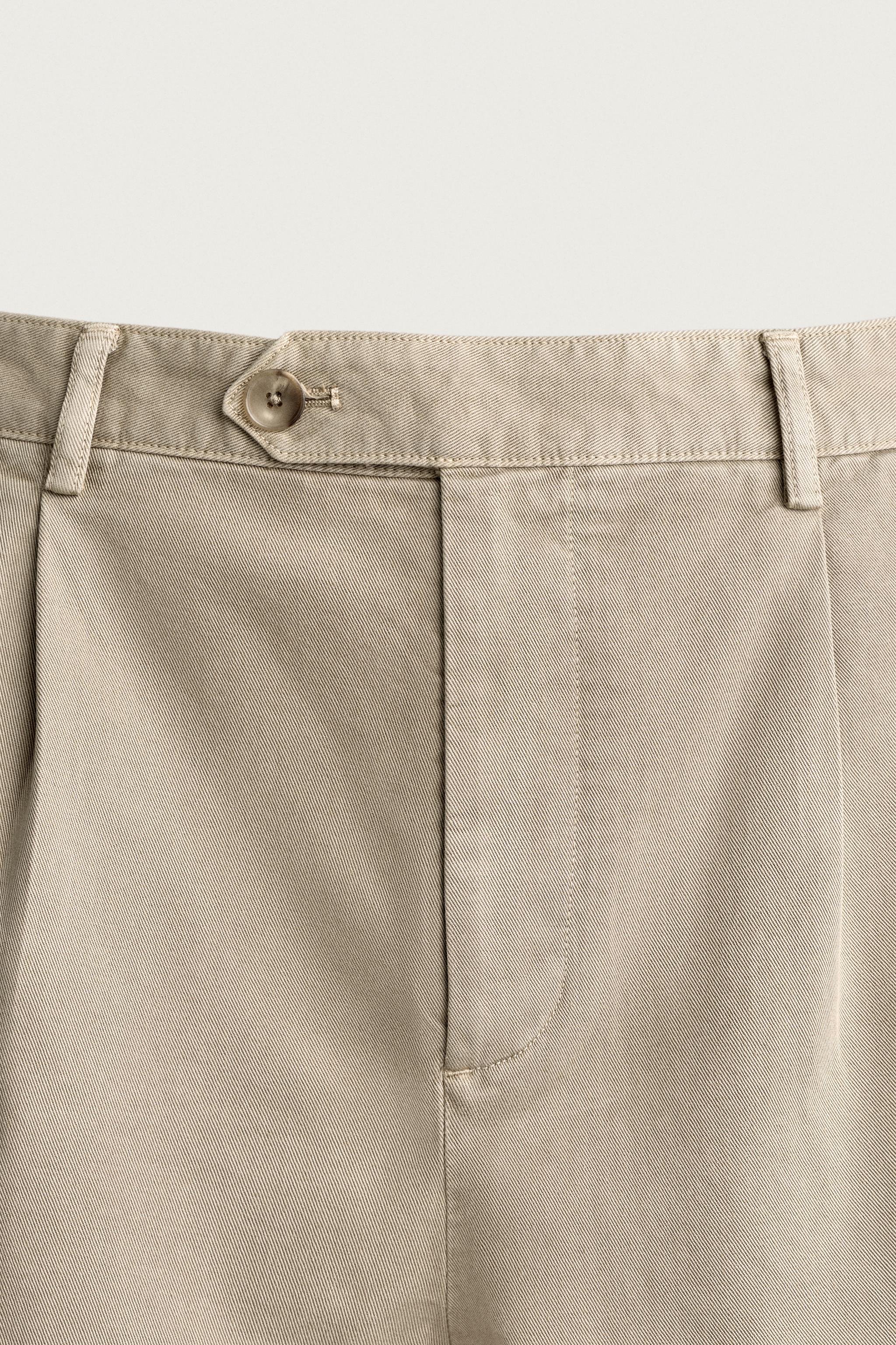 RELAXED FIT PLEATED CHINO PANTS