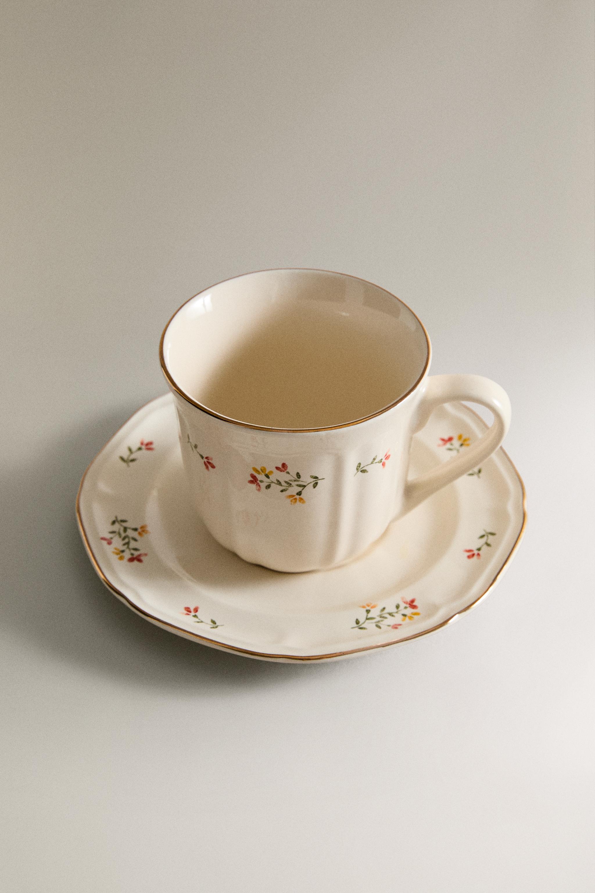 FLORAL PORCELAIN TEACUP AND SAUCER — Cream