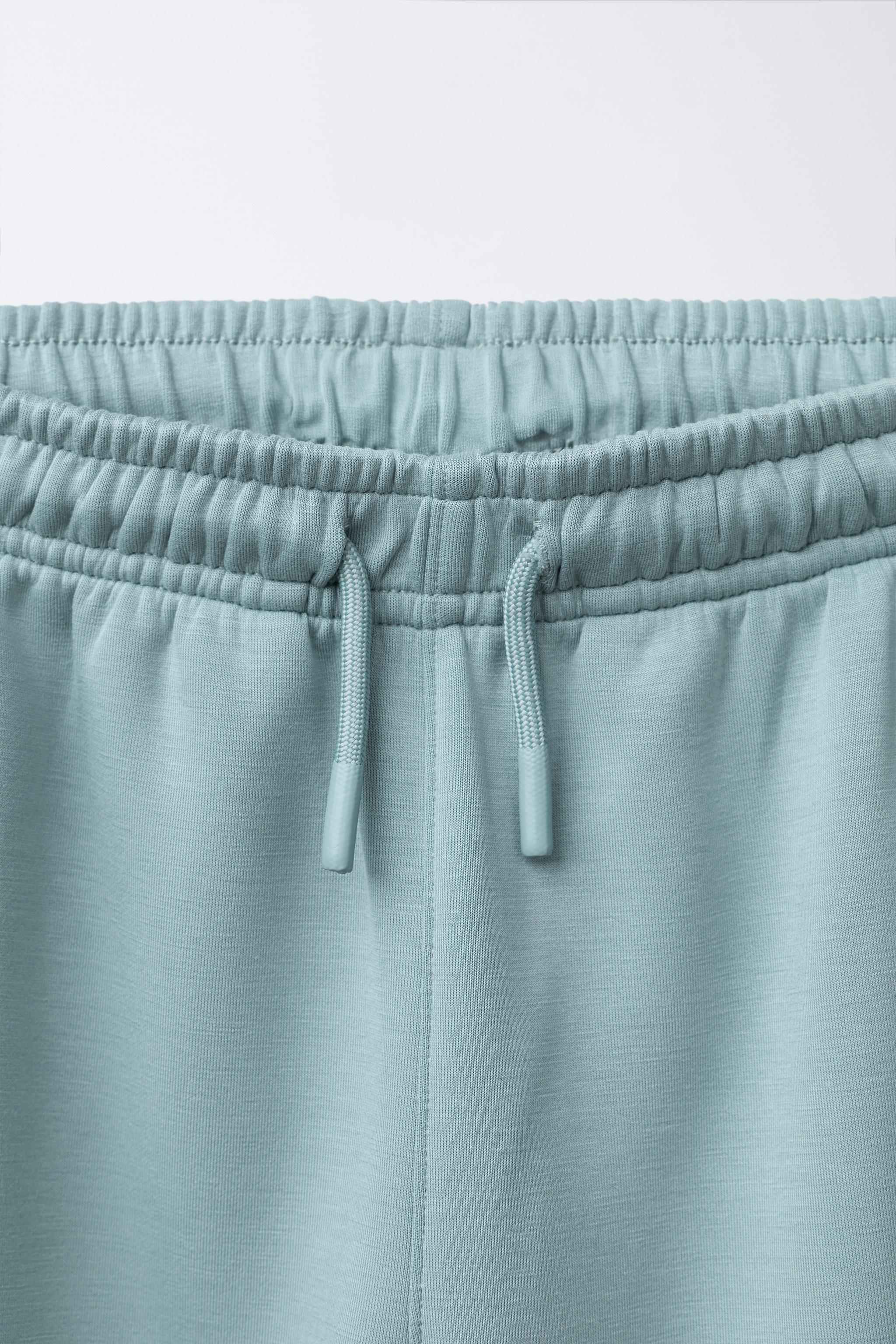 SPORTY JOGGER PANTS WITH RUBBERIZED LABEL