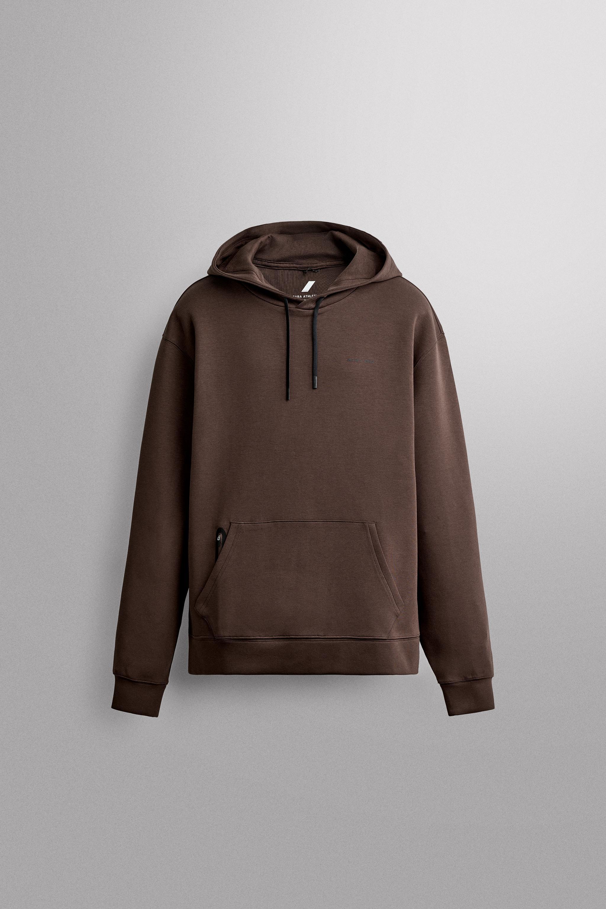 SWEAT TECHNIQUE À CAPUCHE