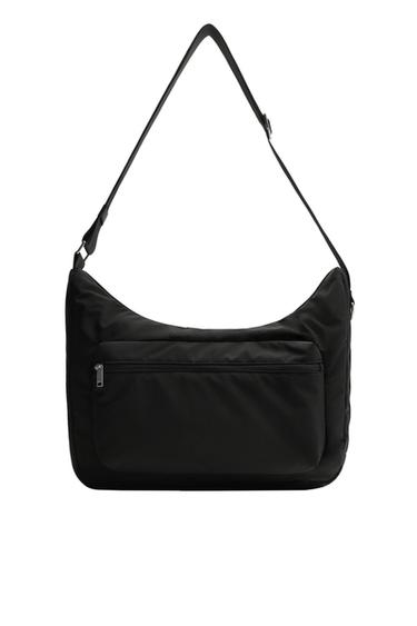 Front view of a black bowling bag with an adjustable strap and a front zip pocket.