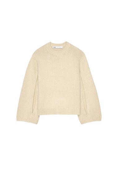 Front view of a beige crew-neck, long-sleeved jumper.