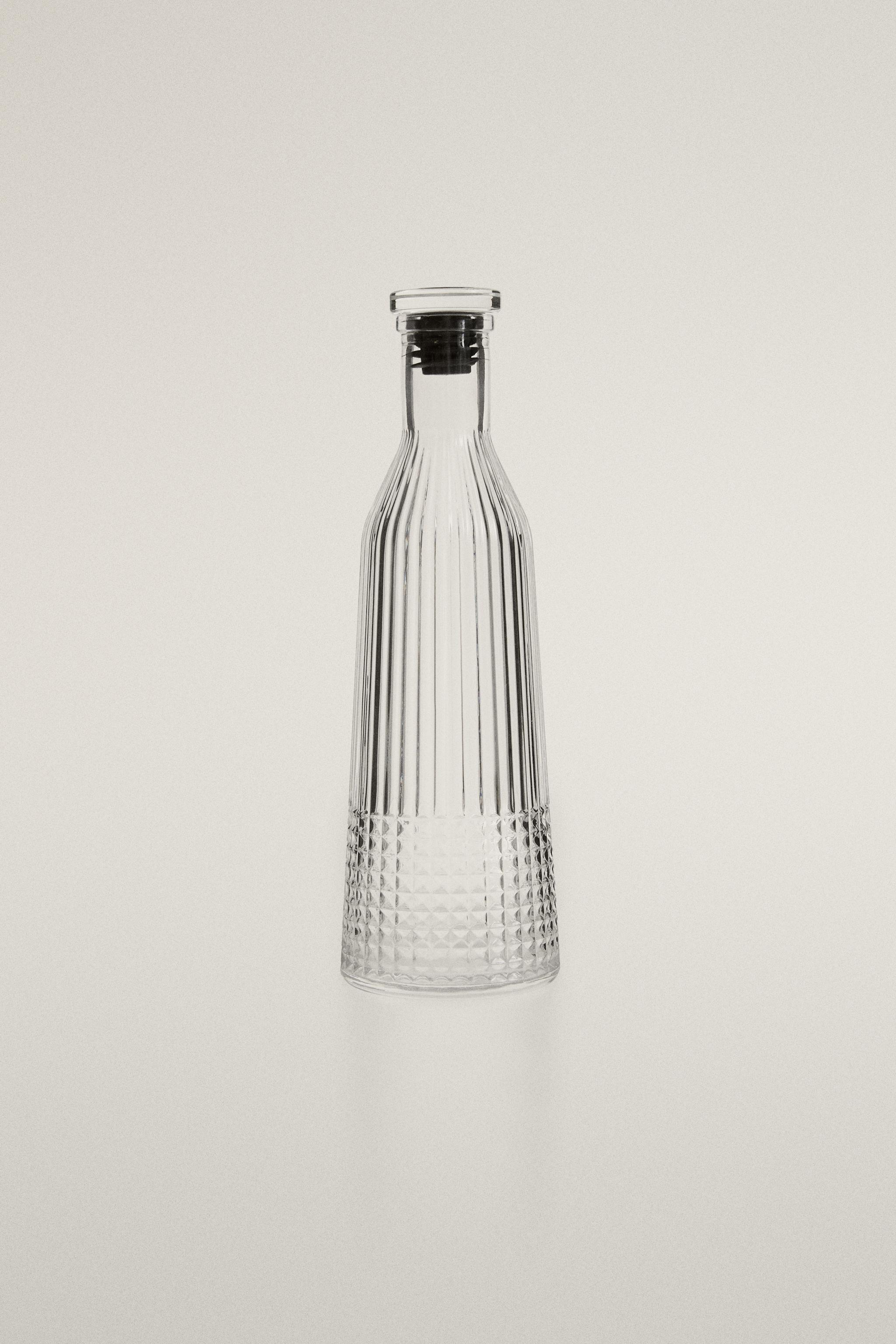 RAISED DESIGN GLASS BOTTLE