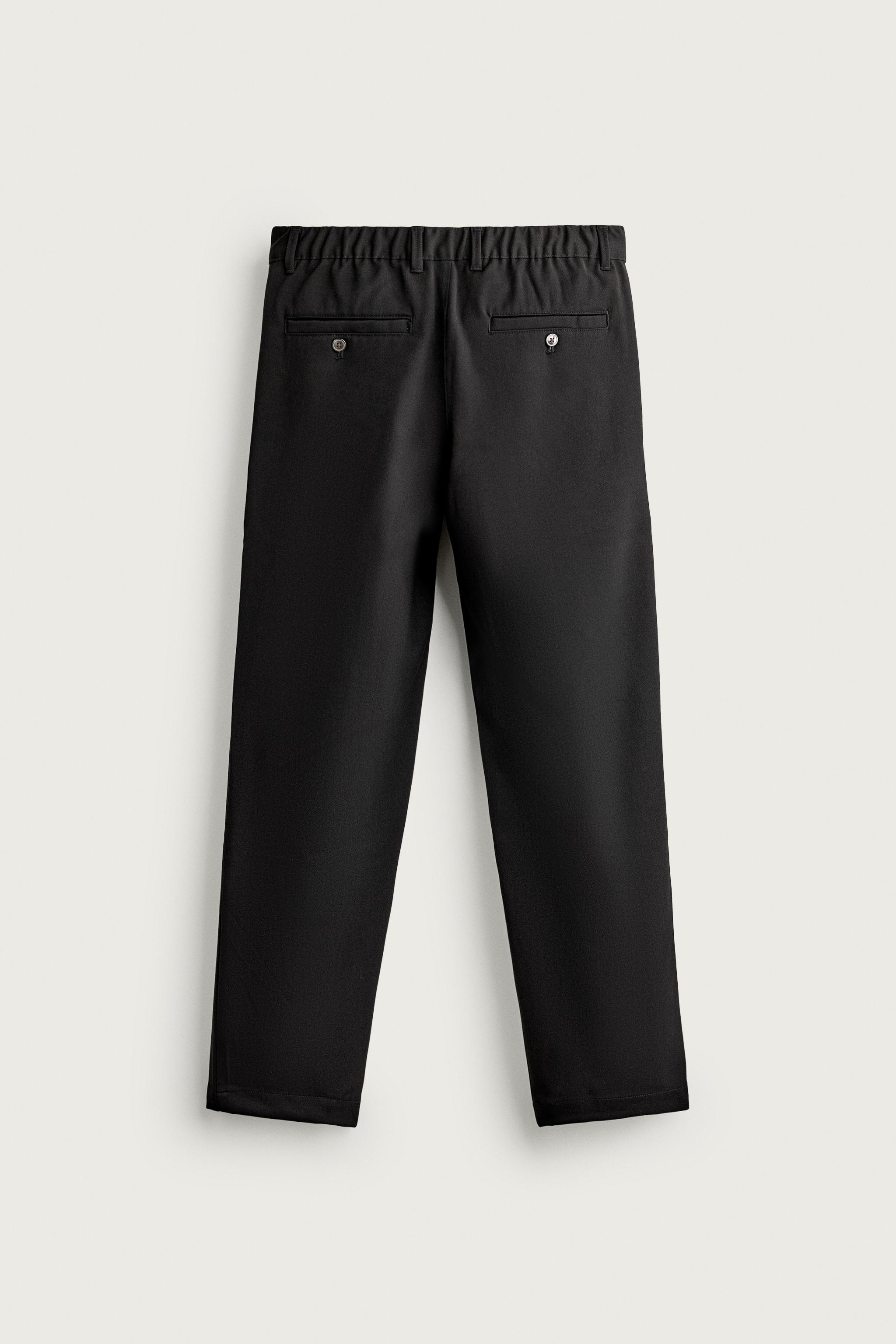 RELAXED FIT PLEATED PANTS — Black
