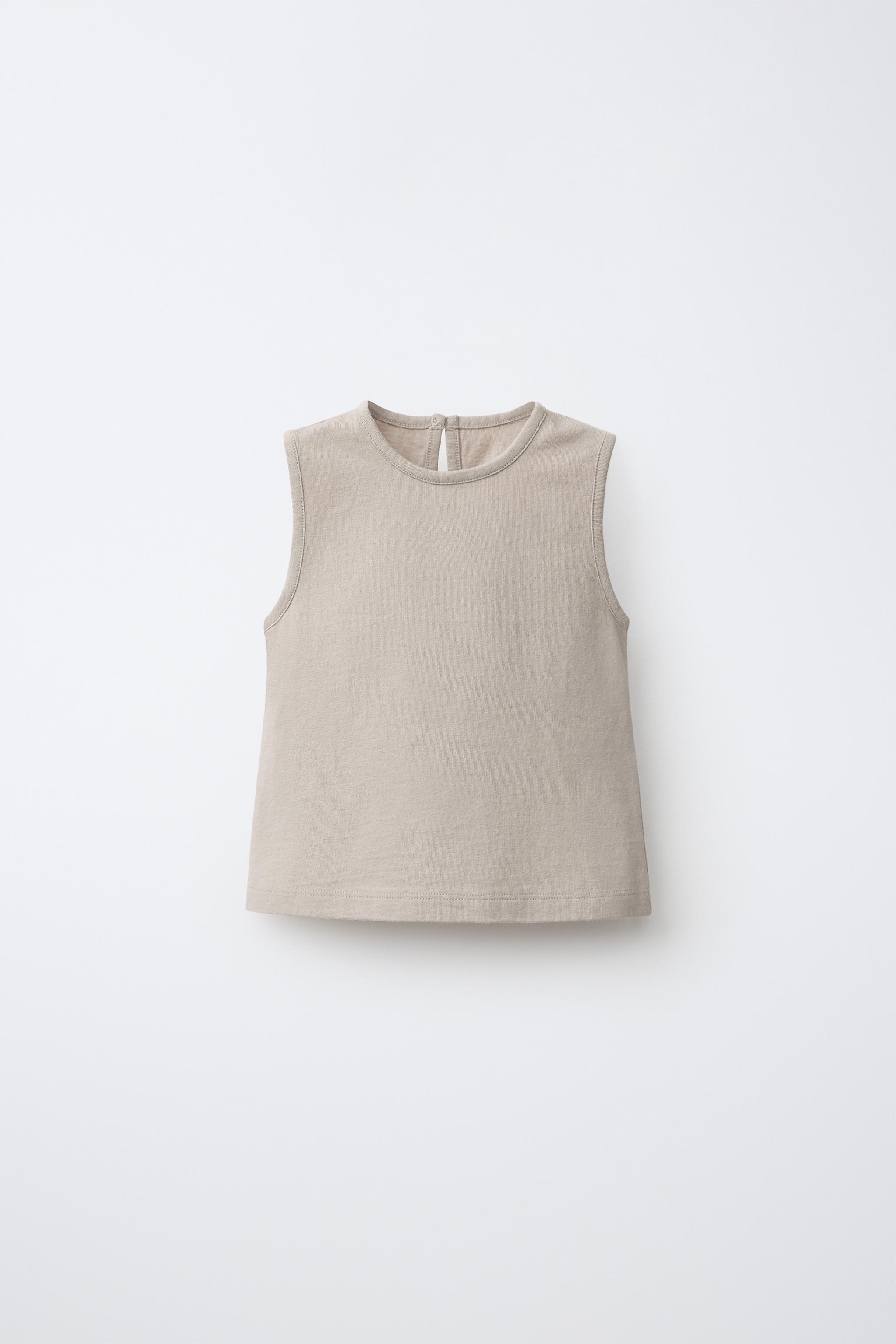 T-SHIRT SANS MANCHES À BOUTON