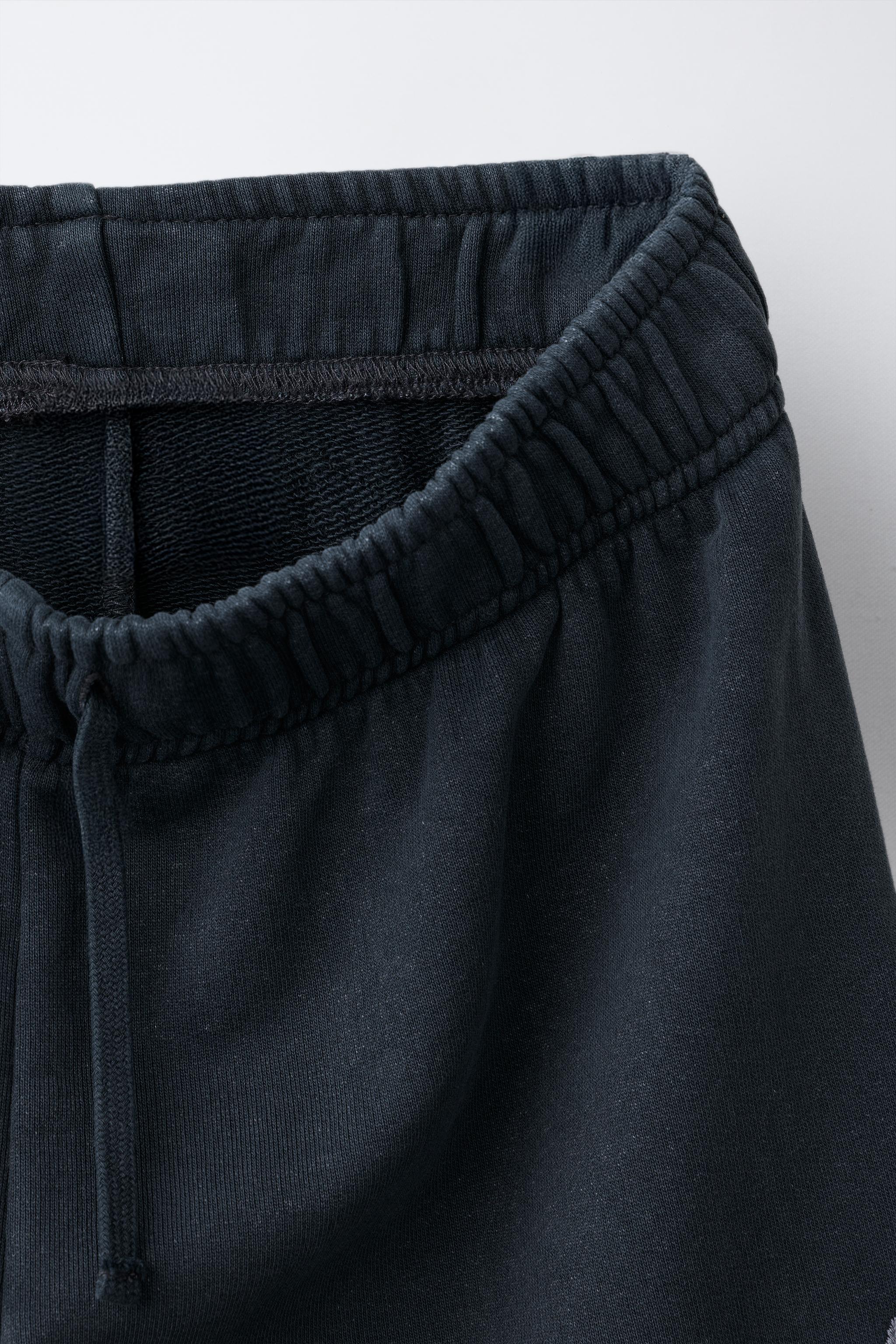 PANTALON EN MOLLETON EFFET DÉLAVÉ À JAMBES LARGES ÉTOILES