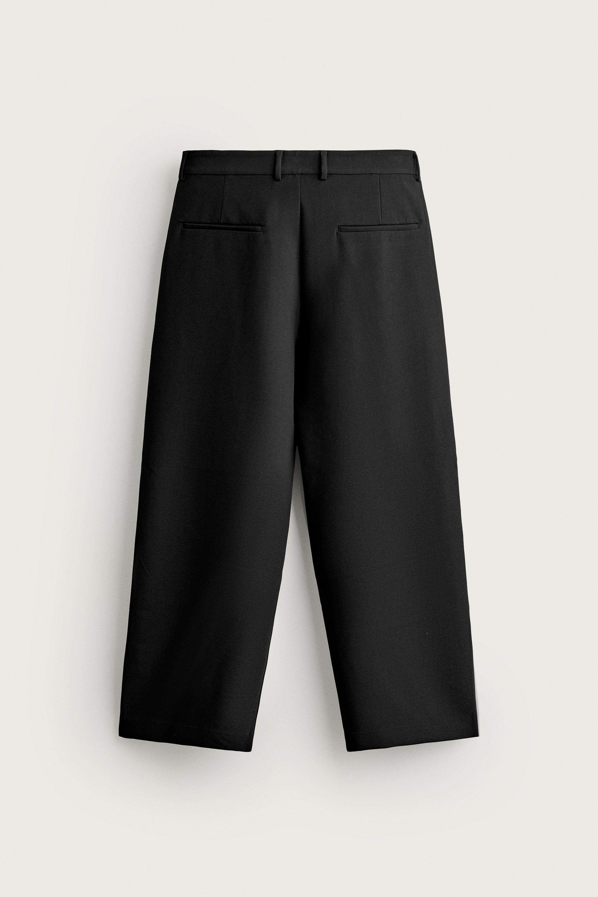 RELAXED FIT PLEATED PANTS