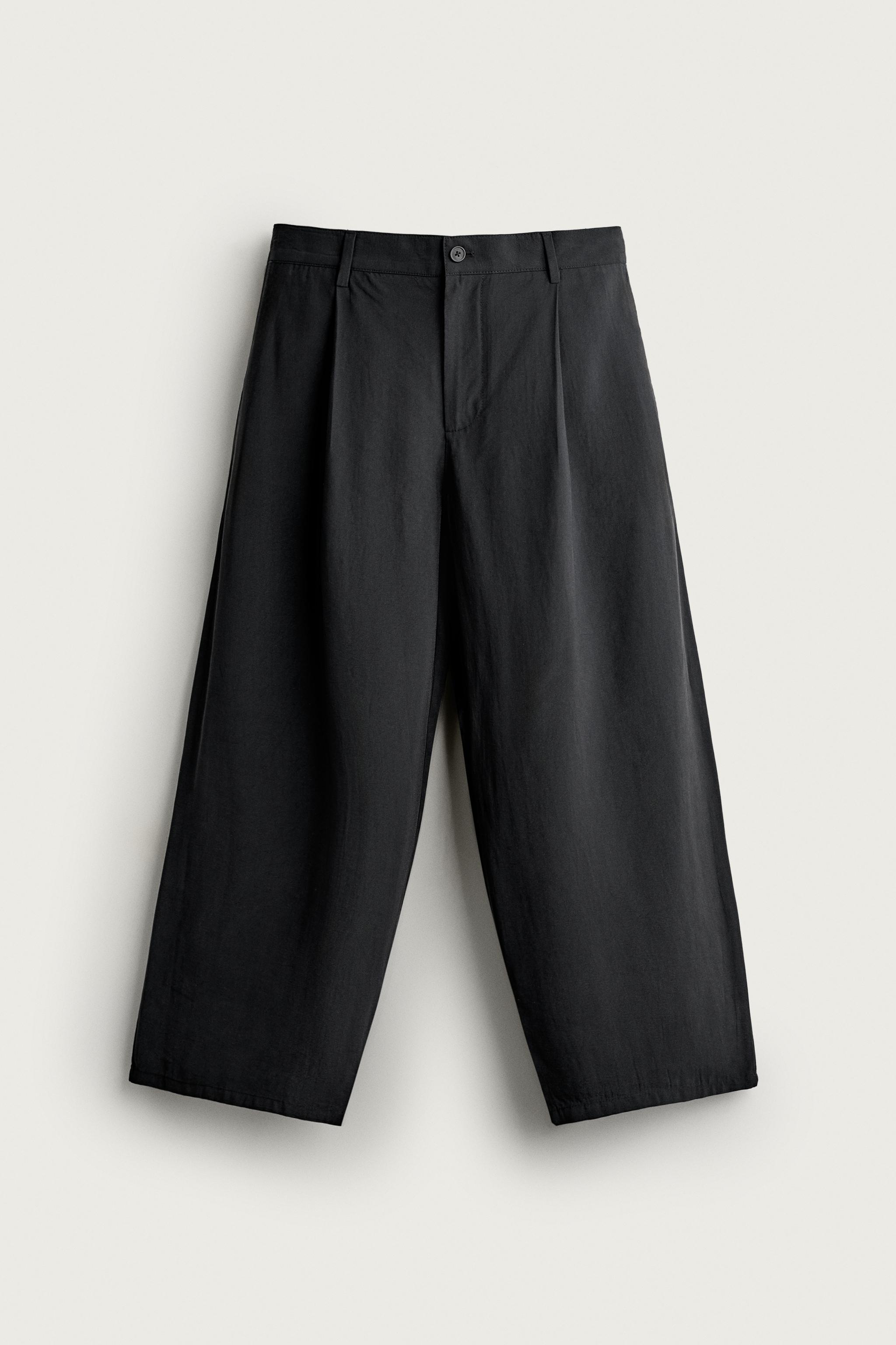 Relaxed-Fit Pleated Fluid Trousers — Black