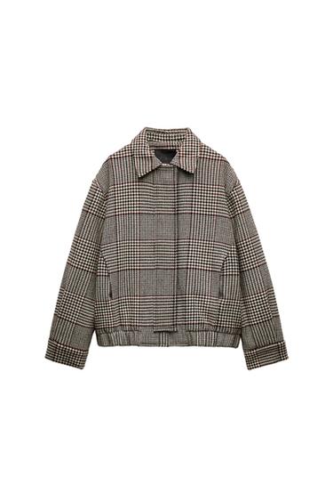Front view of brown check jacket with side pockets.