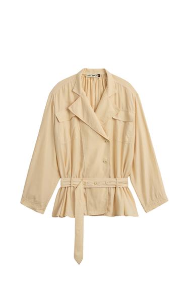 Front view of a beige jacket with a belt, wide lapels, front flap pockets, and button fastening.