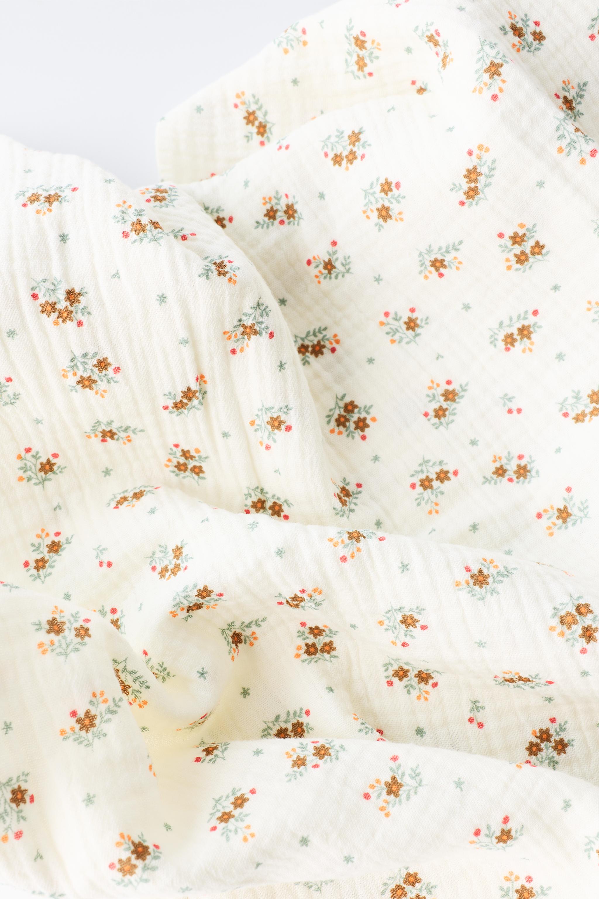 FLORAL PRINT TEXTURED LACE BLANKET — Ecru