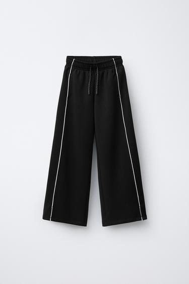 بنطلون بالمودال وبييهات بلون متباين - أسود الخاص بـ Zara - صورة 0