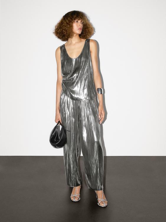 Flowing metallic trousers with gathered detail