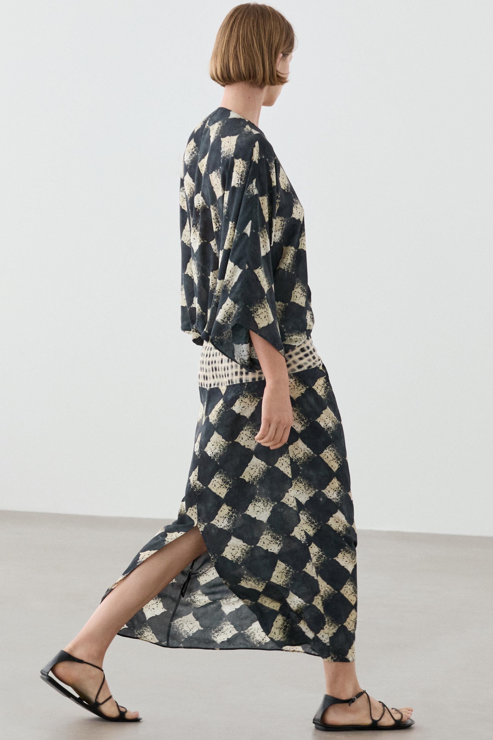Flowing dress with sash belt detail