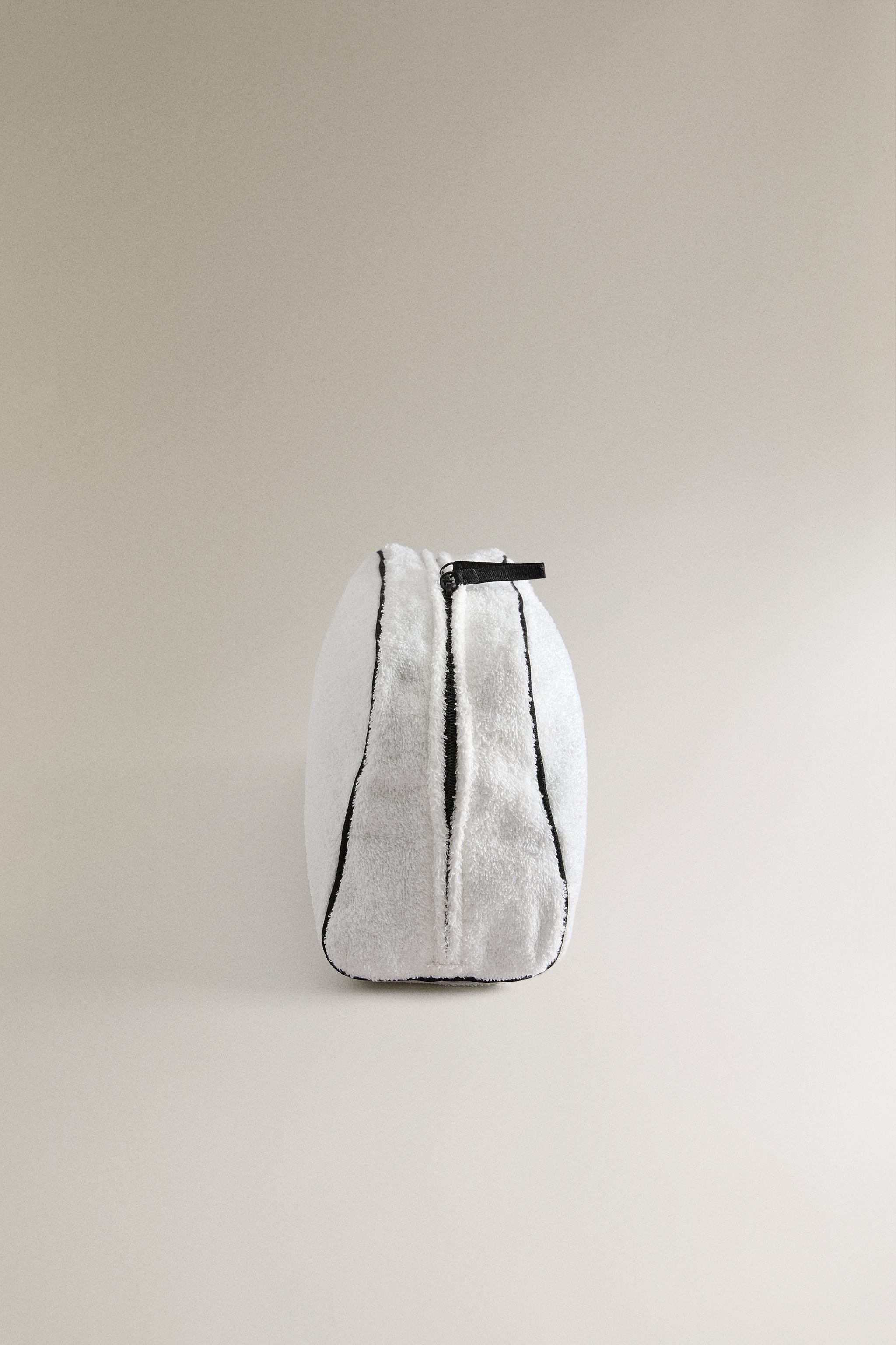 TERRY CLOTH TOILETRY BAG WITH PIPING DETAIL