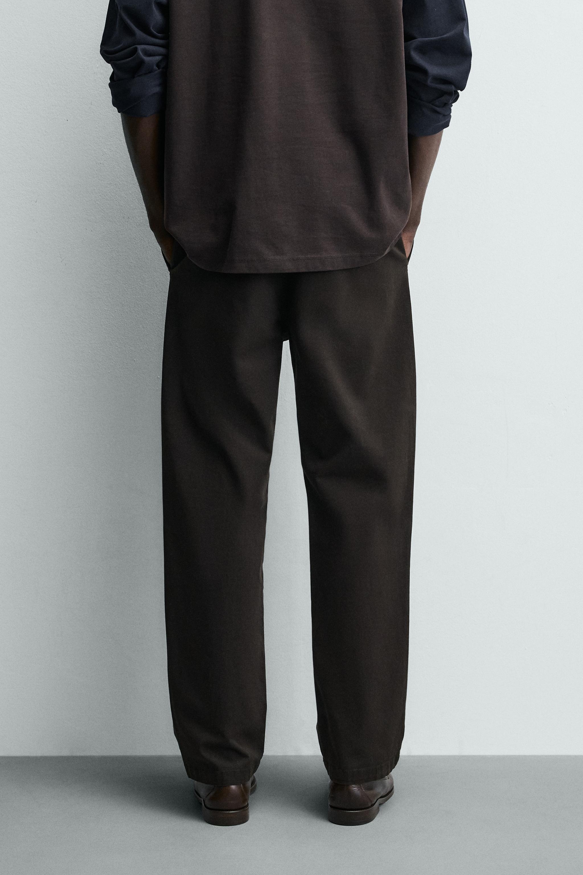 RELAXED FIT PLEATED PANTS