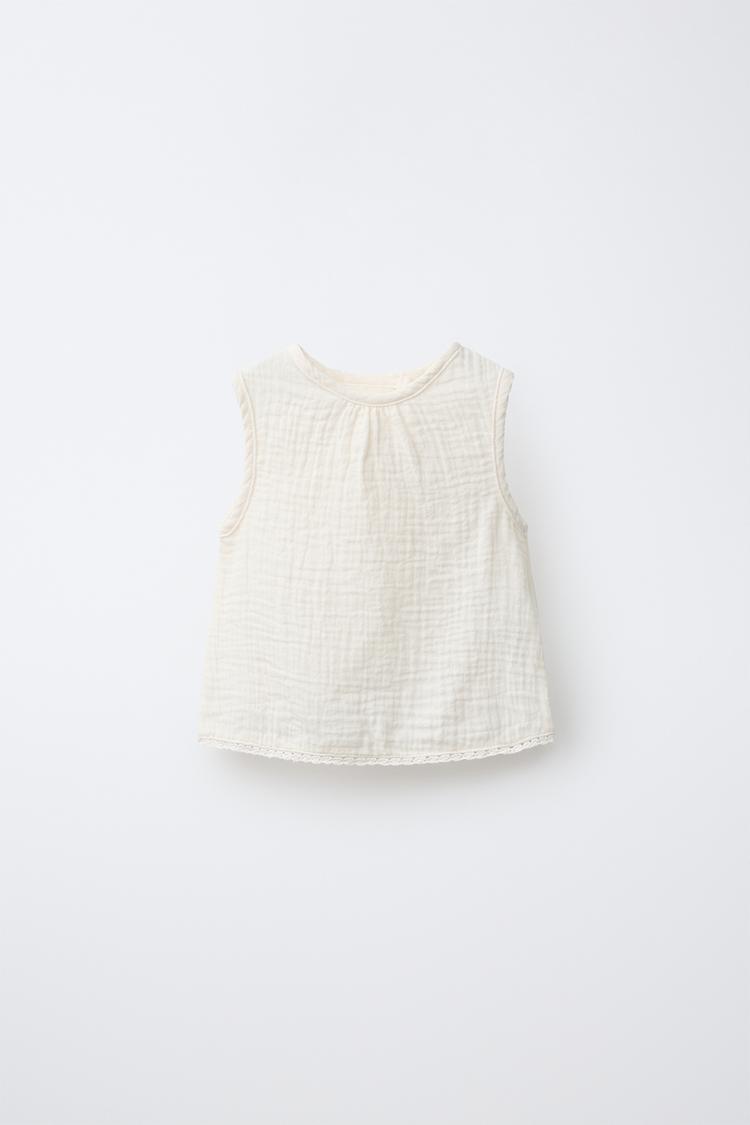 Blusa de encaje texturizado