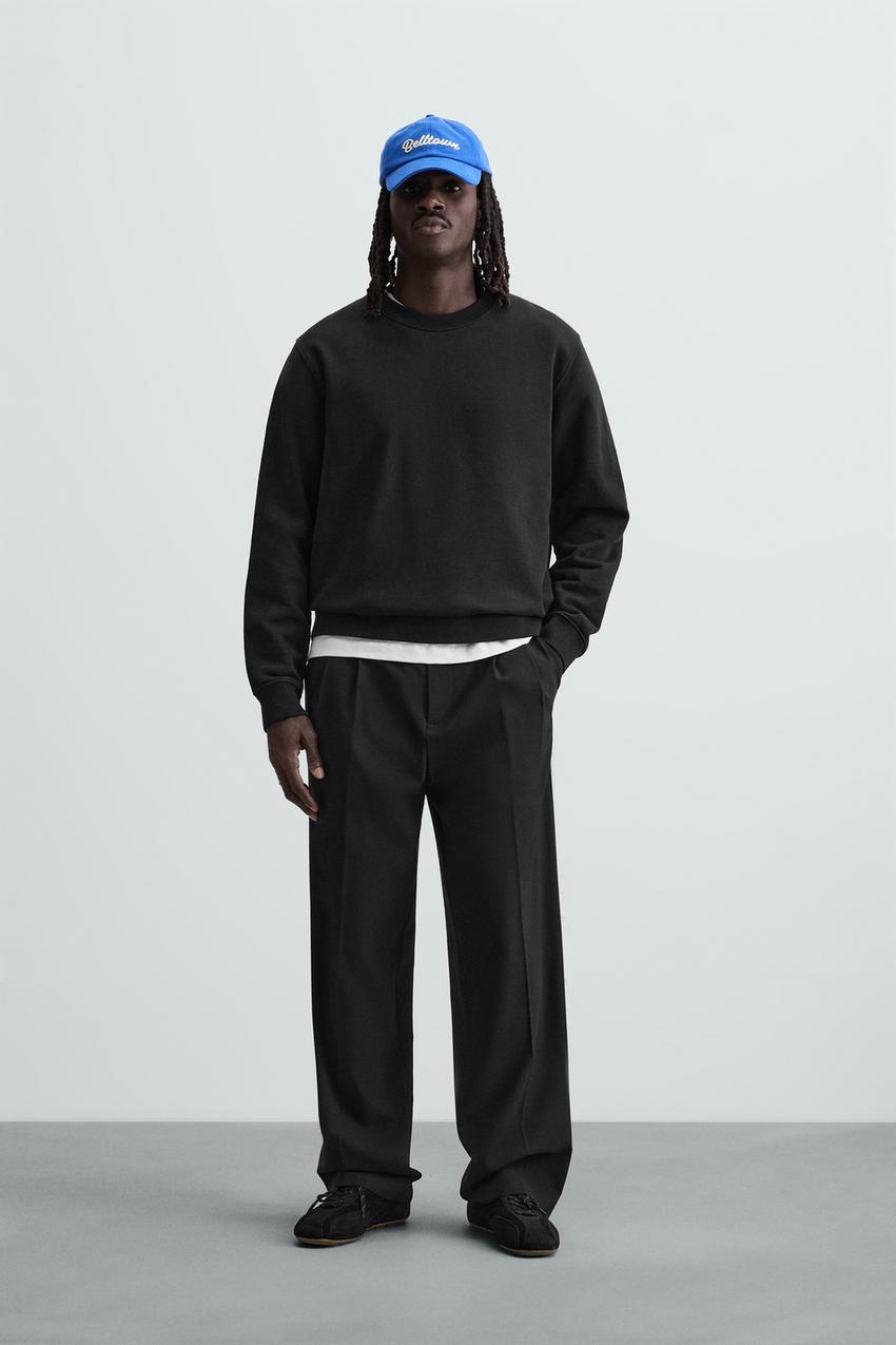 WIDE FIT PLEATED TROUSERS