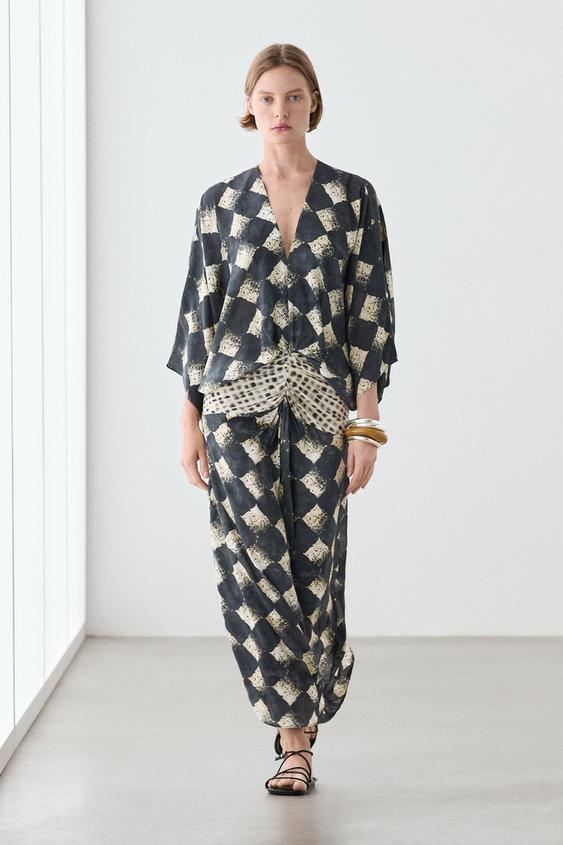 Flowing dress with sash belt detail from Zara - $290