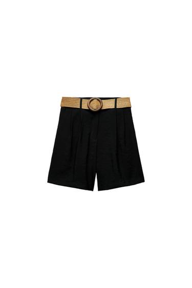 Front view of black shorts with a gold belt and a round buckle.