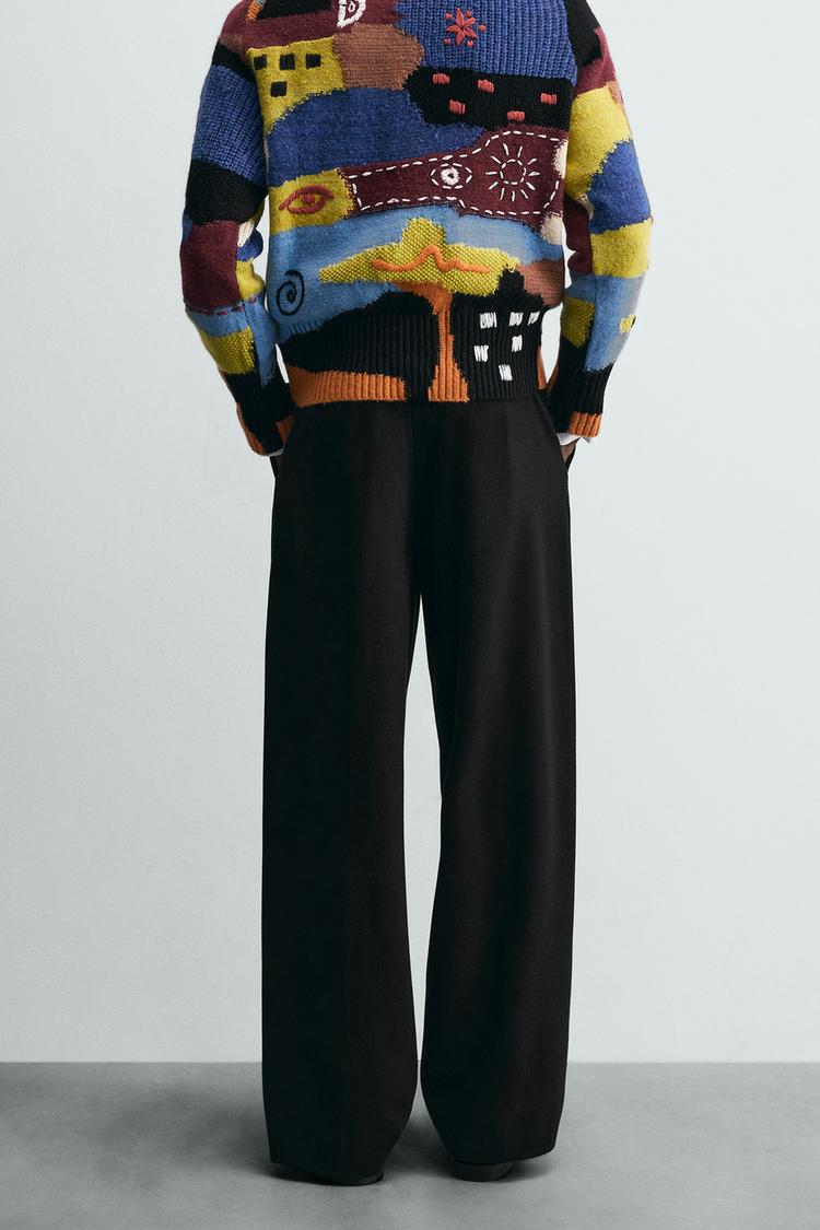 RELAXED FIT PLEATED TROUSERS