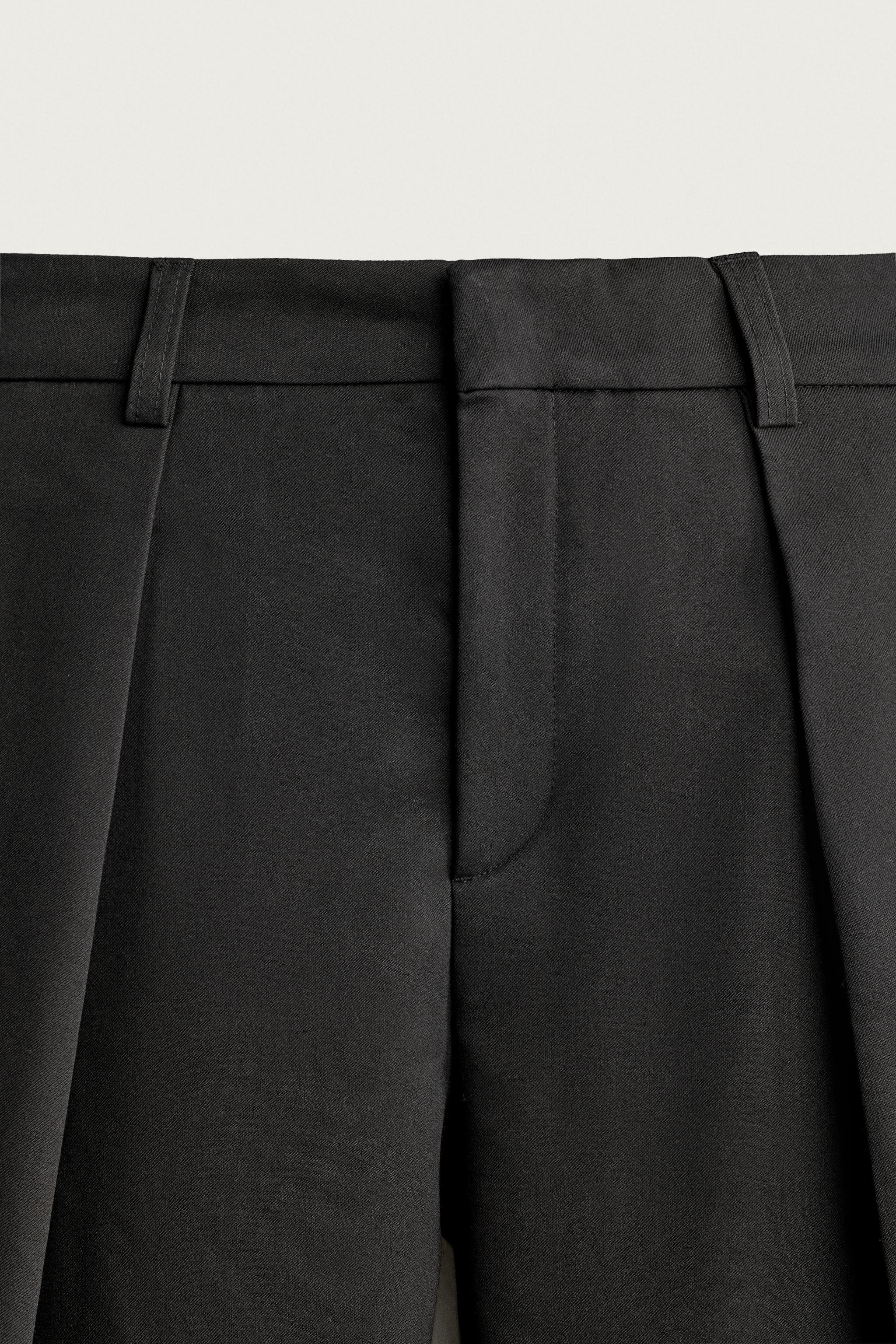 PLEATED RELAXED-FIT PANTS
