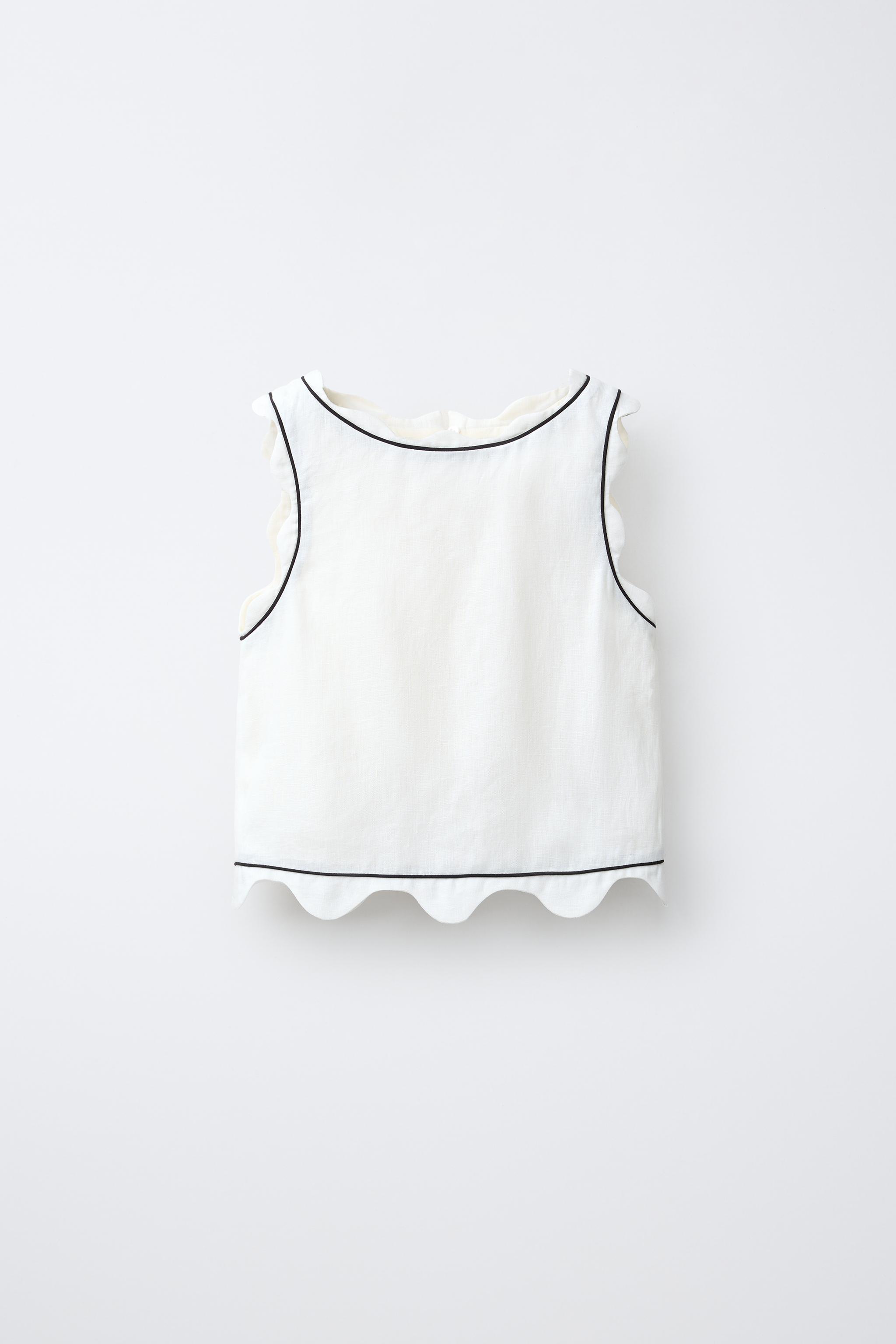 SCALLOPED TOP WITH CONTRAST PIPING