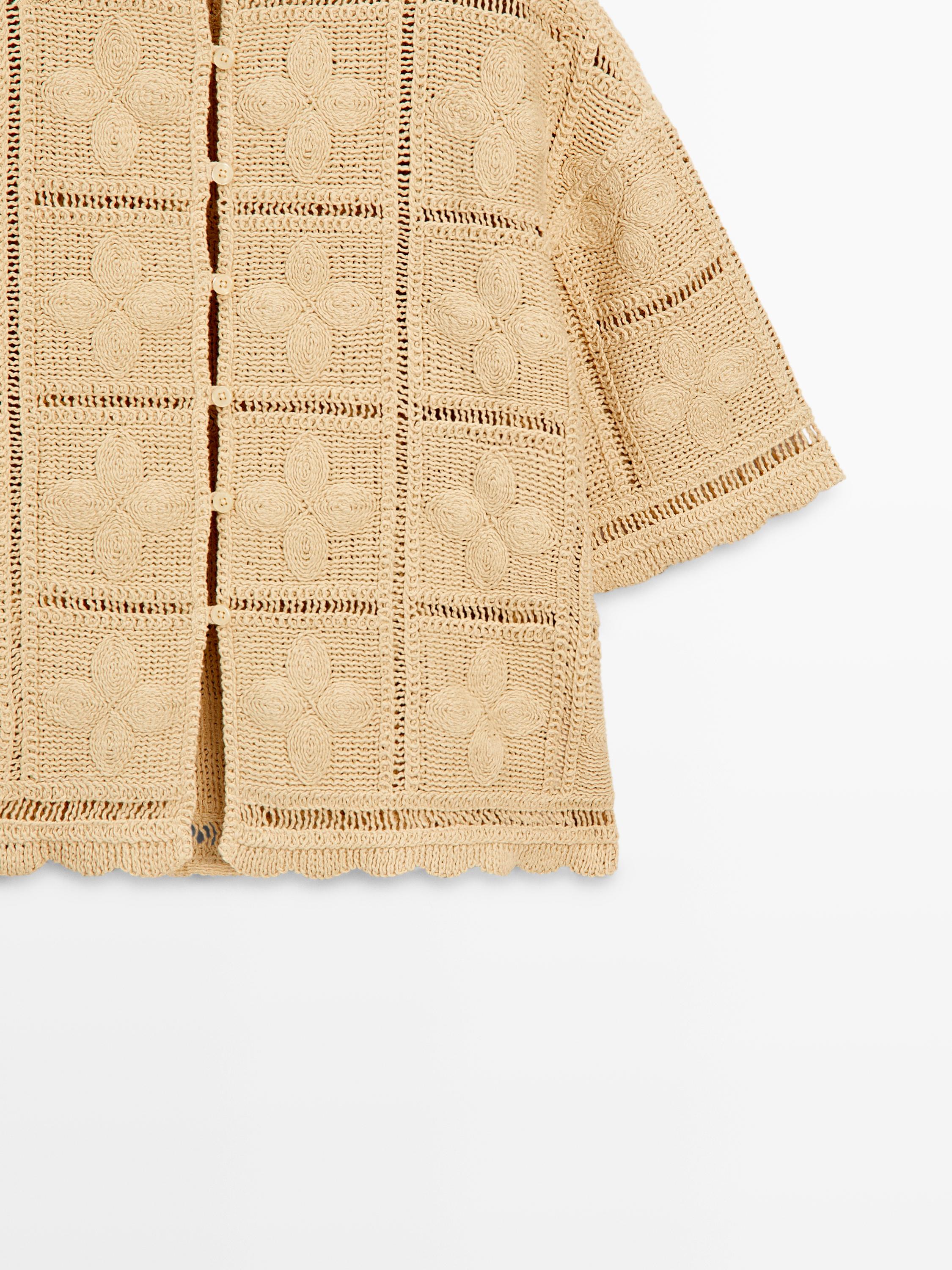 Veste en maille ajourée et crochet
