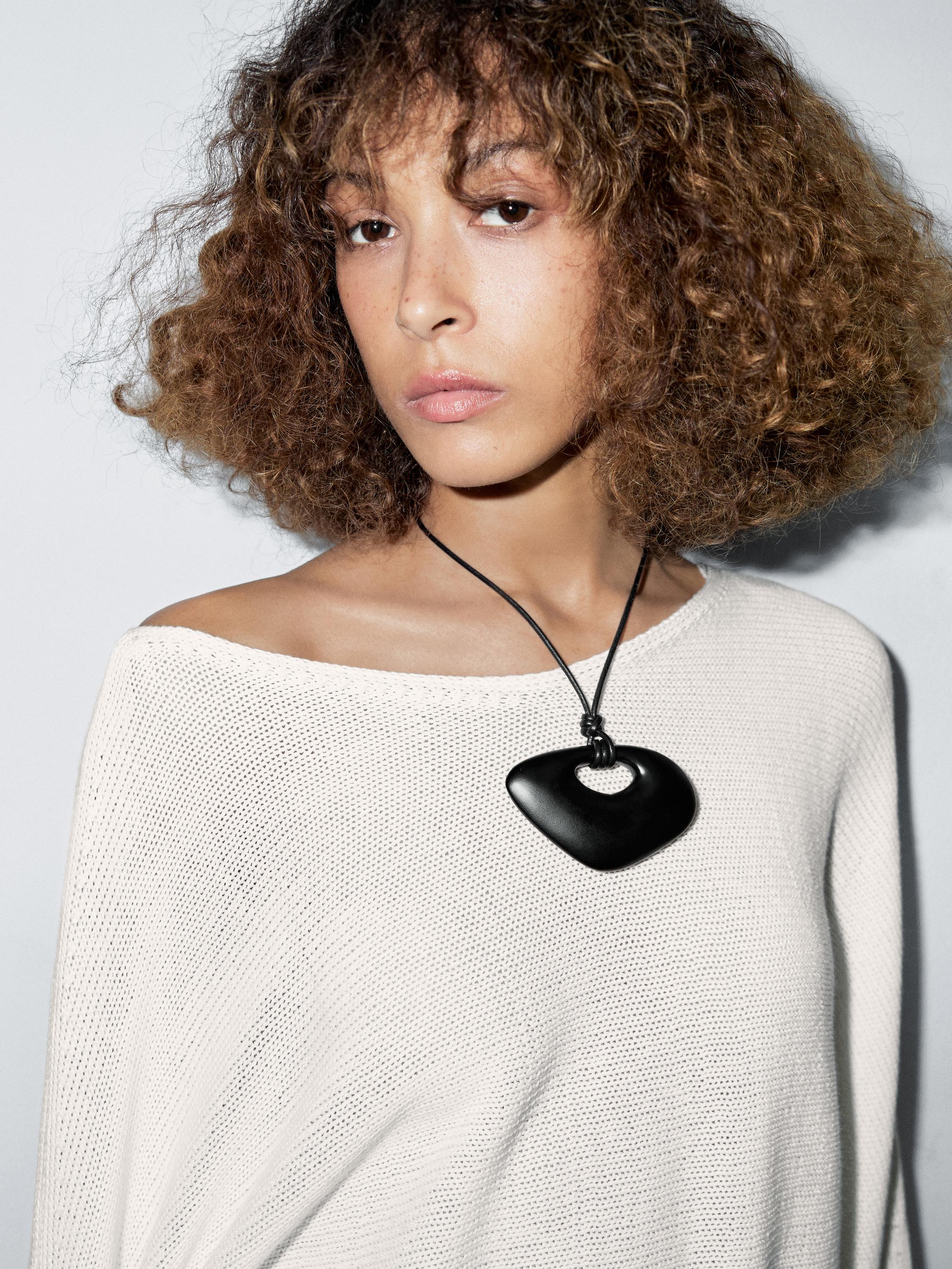 Knit sweater with bow detail