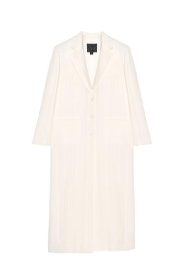 Front view of a long white coat with lapels and side pockets.
