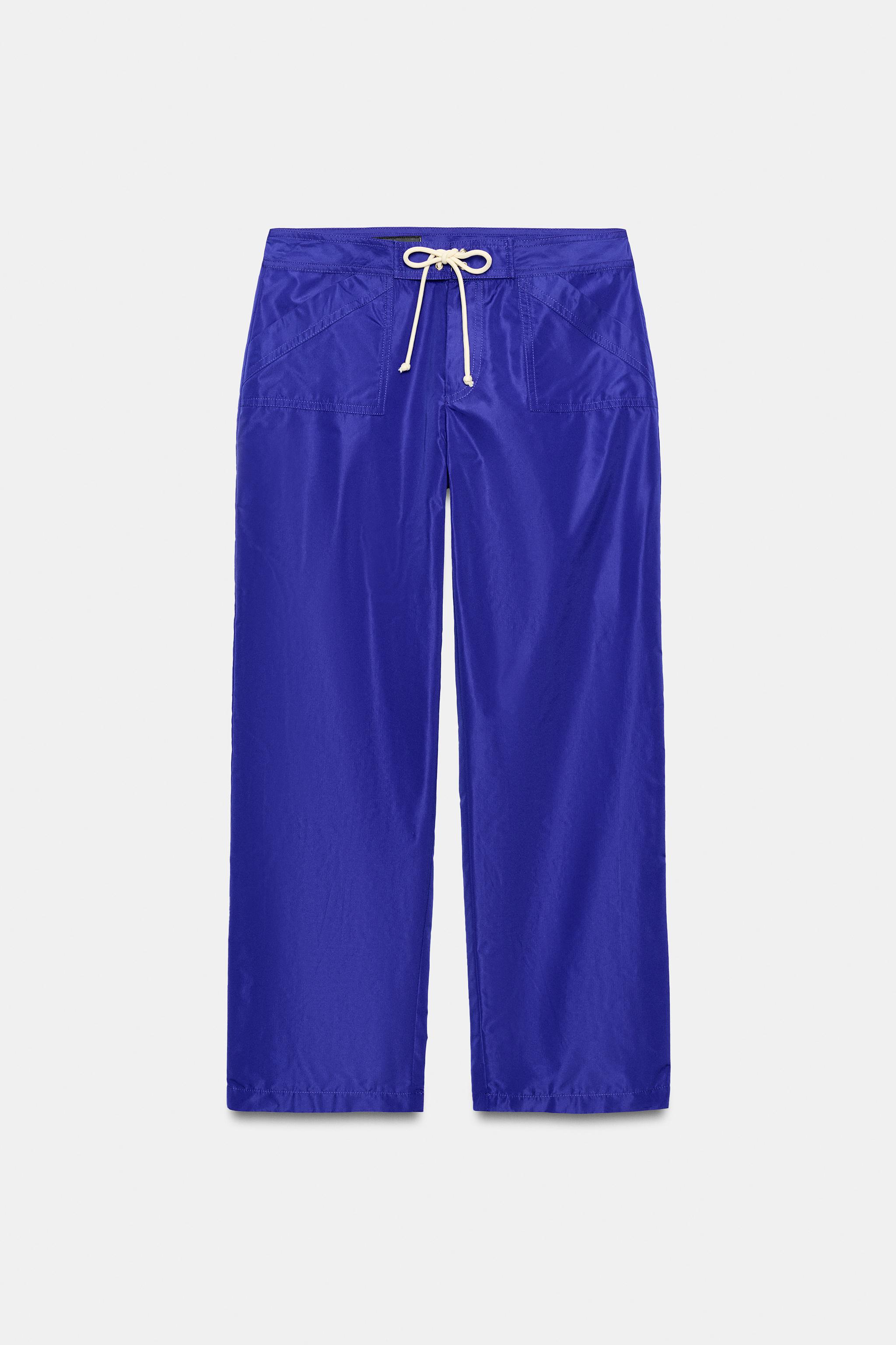 PANTALON EN NYLON COURT AVEC CORDONS