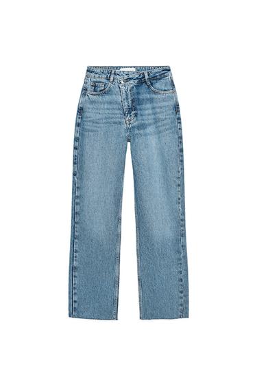 Front view of blue jeans with front pockets and button fastening.