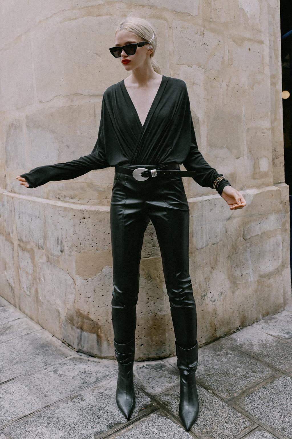 LEATHER EFFECT TROUSERS WITH ZIPPED HEMS