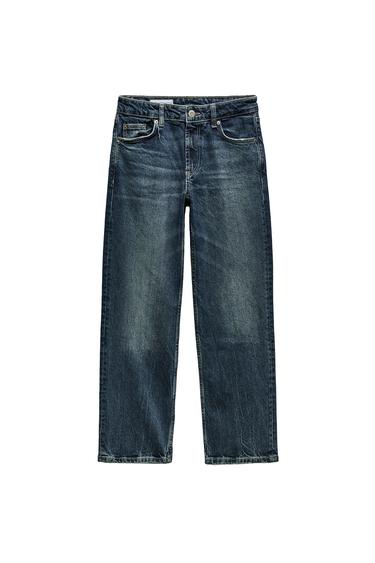 Front view of blue jeans with front pockets and button closure.