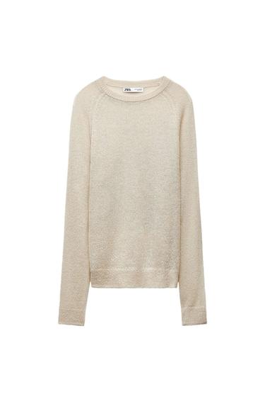 Front view of a long-sleeved, crew neck, beige sweater.